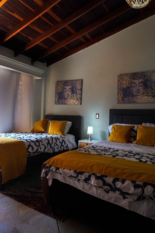 Imagen de la habitación del Hotel CORONA HOUSE. Foto 14