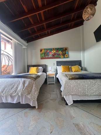 Imagen de la habitación del Hotel CORONA HOUSE. Foto 15