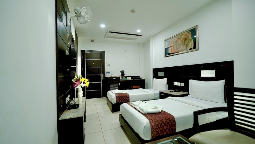 Imagen de la habitación del Hotel CORPORATE STAYS-SUNCITY, Gurugram. Foto 2