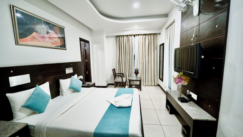 Imagen de la habitación del Hotel CORPORATE STAYS-SUNCITY, Gurugram. Foto 4
