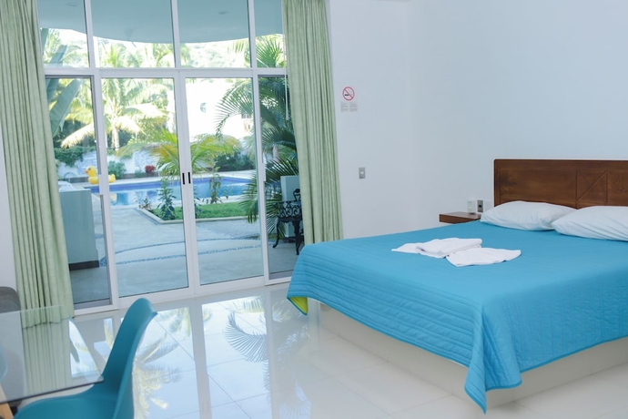 Imagen de la habitación del Hotel COSTA MADERO RESORT. Foto 12