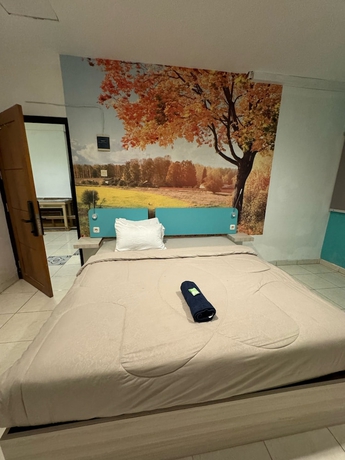 Imagen de la habitación del Hotel COZY CENTRE RESIDENCE SEMARANG. Foto 14