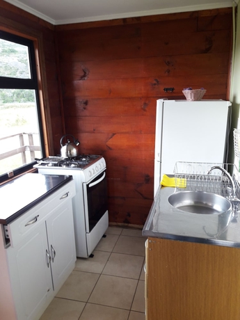 Imagen de la habitación del Hotel Caba&ntilde;as Lago Tyndall. Foto 10