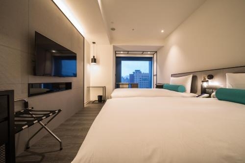Imagen de la habitación del Hotel Caesar Metro Taipei. Foto 9