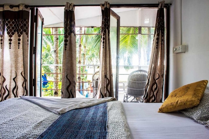 Imagen de la habitación del Hotel Cafe Del Mar Cottages And Rooms. Foto 16