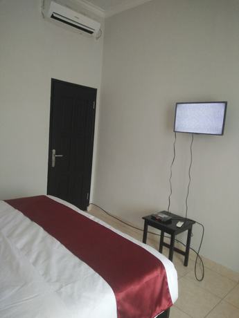 Imagen de la habitación del Hotel Cahaya Adrian. Foto 11