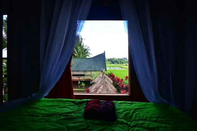 Imagen de la habitación del Hotel Cahaya Tetebatu Inn. Foto 24