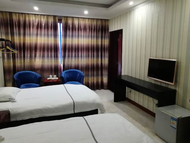 Imagen de la habitación del Hotel Caiyuan. Foto 13