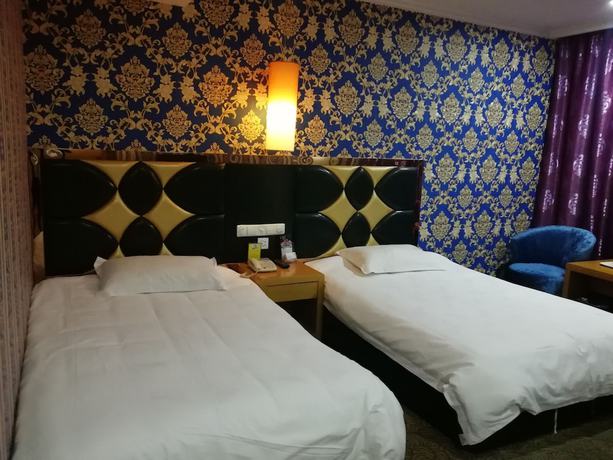 Imagen de la habitación del Hotel Caiyuan. Foto 16