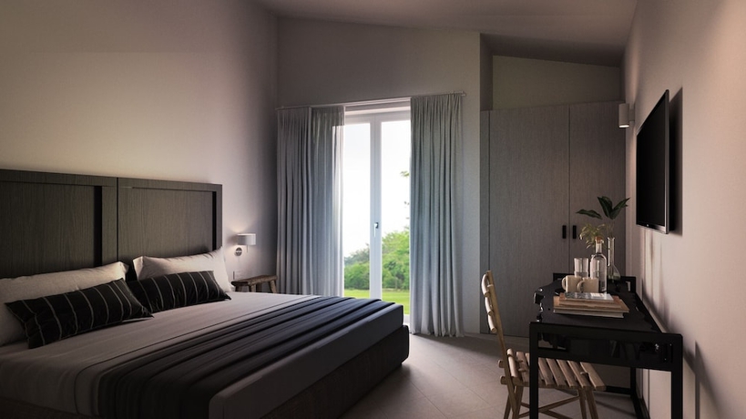 Imagen de la habitación del Hotel Cala Sinzias Resort. Foto 7