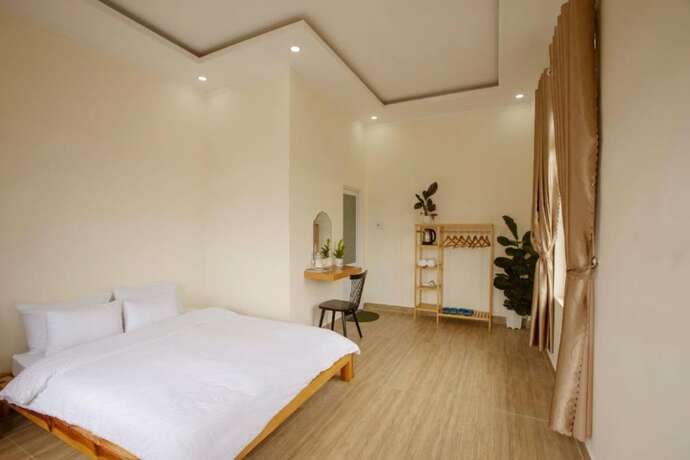 Imagen de la habitación del Hotel Calais Villa. Foto 12