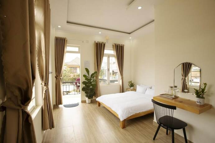 Imagen de la habitación del Hotel Calais Villa. Foto 17