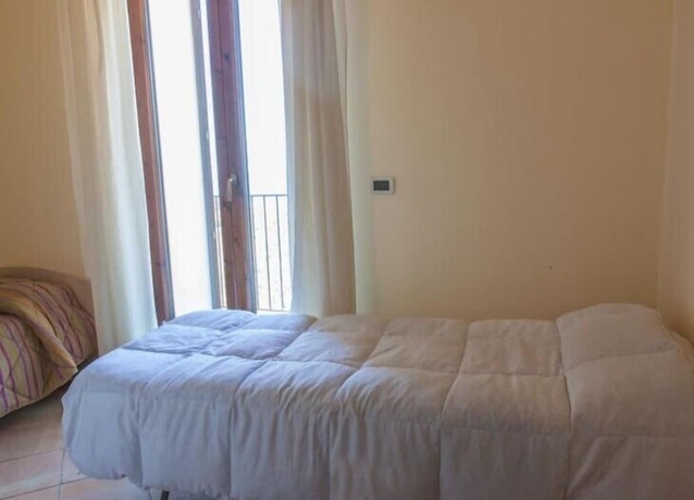 Imagen de la habitación del Hotel Calajò Resort. Foto 6