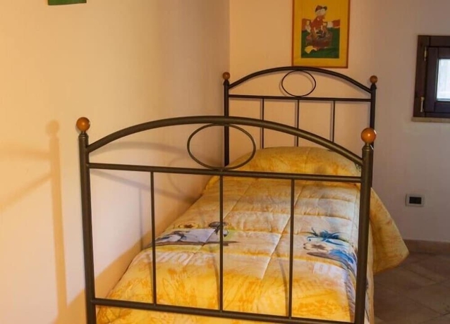 Imagen de la habitación del Hotel Calajò Resort. Foto 8