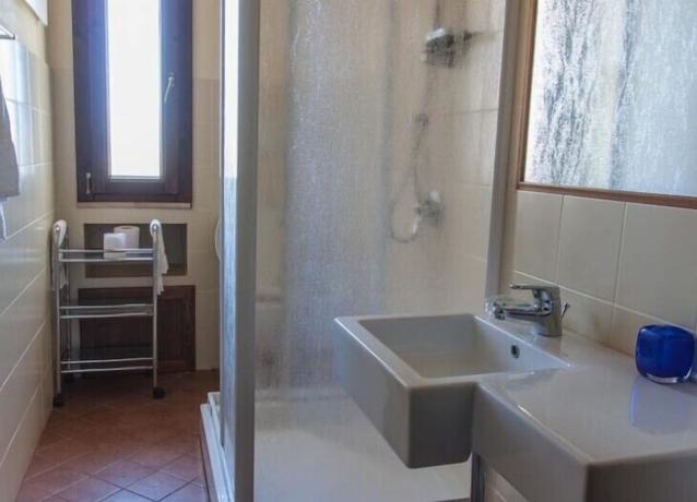 Imagen de la habitación del Hotel Calajò Resort. Foto 16