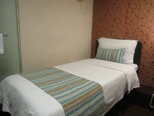 Imagen de la habitación del Hotel California, Tsim Sha Tsui. Foto 2