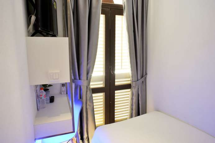 Imagen de la habitación del Hotel Calmo Chinatown. Foto 9