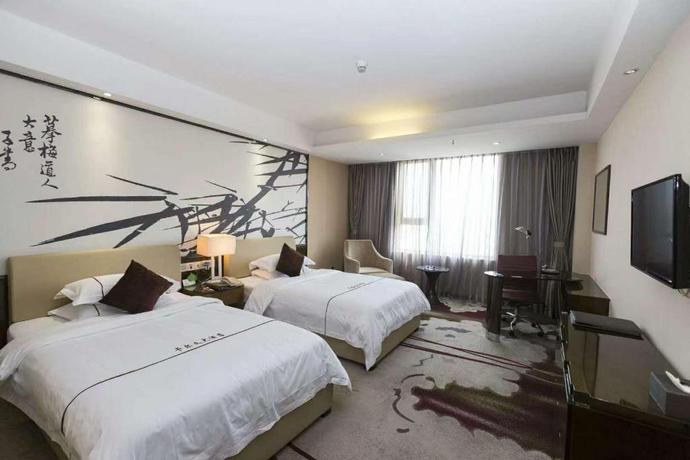 Imagen de la habitación del Hotel Calvin Hotel Guangzhou Huadu. Foto 3