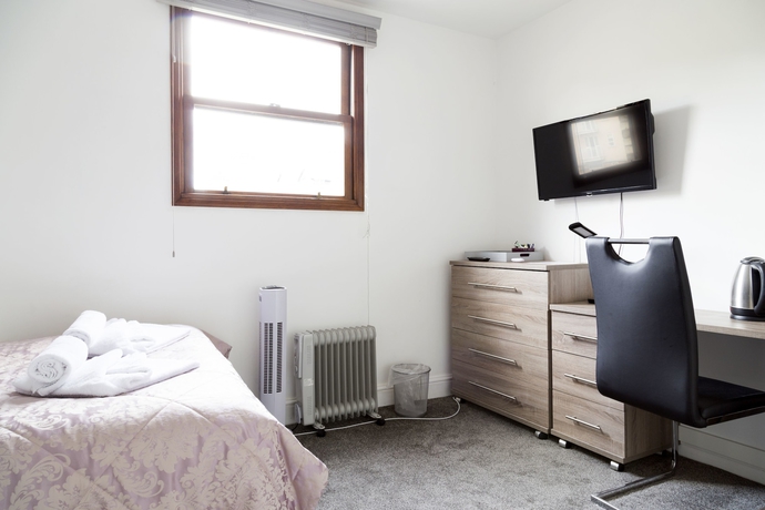 Imagen de la habitación del Hotel Cambridge City Rooms By Paymán Club. Foto 7