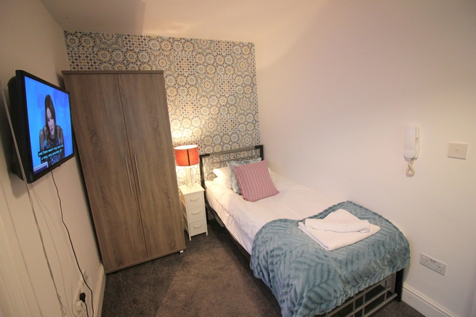 Imagen de la habitación del Hotel Cambridge City Rooms By Paymán Club. Foto 11