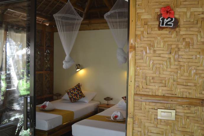 Imagen de la habitación del Hotel Camiguin Volcan Beach Eco Retreat and Dive Resort. Foto 10