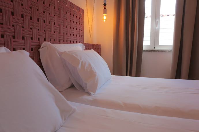 Imagen de la habitación del Hotel Caminha Hostel and Suites. Foto 14