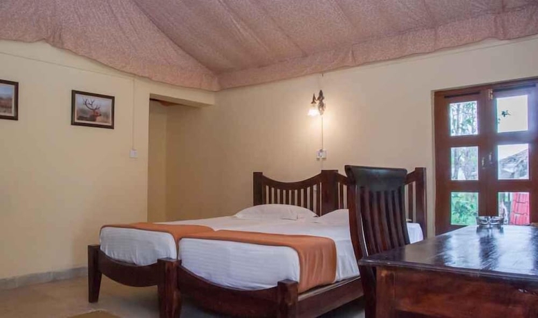 Imagen de la habitación del Hotel Camp Dev Vilas Kanha. Foto 11