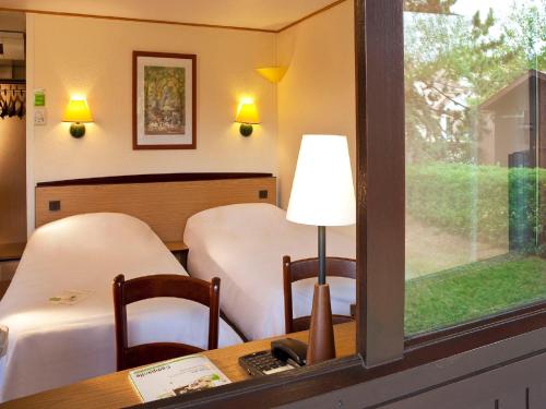 Imagen de la habitación del Hotel Campanile Alencon. Foto 17