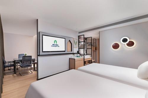 Imagen de la habitación del Hotel Campanile Liaocheng Bus Terminal Wanda Plaza. Foto 20