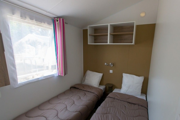 Imagen de la habitación del Hotel Camping La Palmyre Estanquet. Foto 9