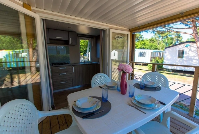 Imagen de la habitación del Hotel Camping La Palmyre Estanquet. Foto 10