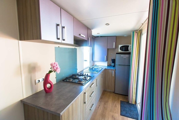 Imagen de la habitación del Hotel Camping La Palmyre Estanquet. Foto 14