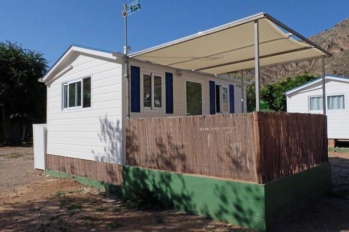 Imagen de la habitación del Hotel Camping Naturista El Port&uacute;s. Foto 9