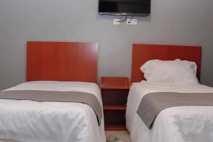Imagen de la habitación del Hotel Camsupreme Studios Meru. Foto 4