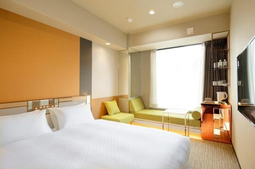 Imagen de la habitación del Hotel Candeo Hotels Tokyo Roppongi. Foto 8