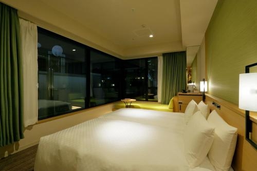Imagen de la habitación del Hotel Candeo Hotels Tokyo Shimbashi. Foto 9