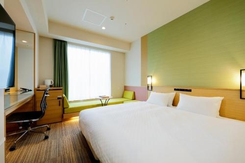 Imagen de la habitación del Hotel Candeo Hotels Tokyo Shimbashi. Foto 10