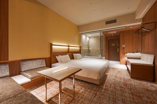 Imagen de la habitación del Hotel Candeos Osaka Hirakata. Foto 12