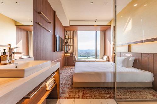 Imagen de la habitación del Hotel Candeos Osaka Hirakata. Foto 15