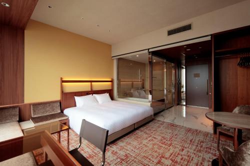 Imagen de la habitación del Hotel Candeos Osaka Hirakata. Foto 19