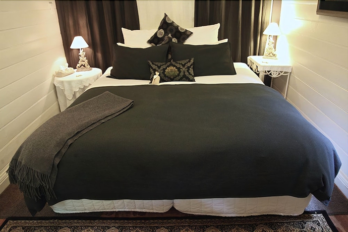 Imagen de la habitación del Hotel Candlelight Cottages. Foto 4