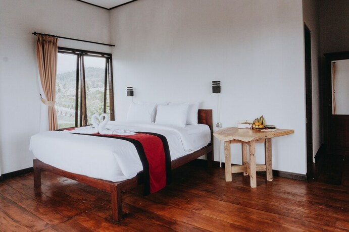 Imagen de la habitación del Hotel Candra Cottage. Foto 26