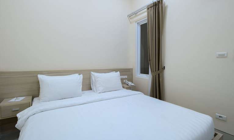 Imagen de la habitación del Hotel Cantik Syari. Foto 5