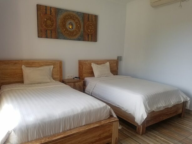 Imagen de la habitación del Hotel Cantika Guest House. Foto 19