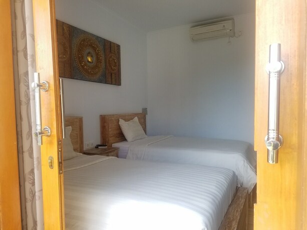 Imagen de la habitación del Hotel Cantika Guest House. Foto 21