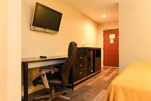 Imagen de la habitación del Hotel Capital Inn And Suites. Foto 6