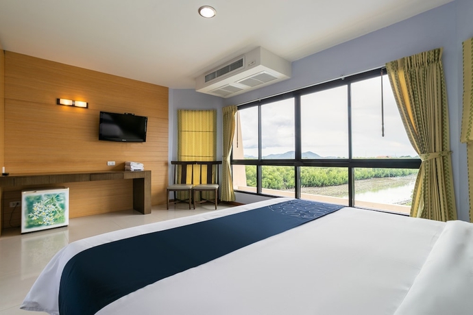 Imagen de la habitación del Hotel Capital O 1008 Golden Beach Boutique Resort. Foto 11