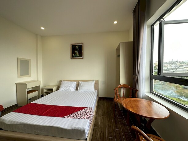 Imagen de la habitación del Hotel Capital O 1208 Phong Van Villa. Foto 11