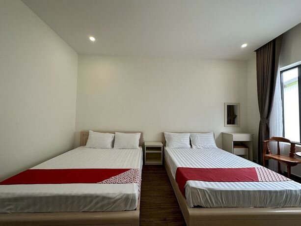 Imagen de la habitación del Hotel Capital O 1208 Phong Van Villa. Foto 16