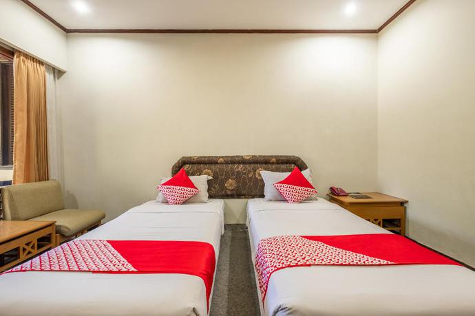 Imagen de la habitación del Hotel Capital O 1256 Sangga Buana Resort and Convention Hotel. Foto 11